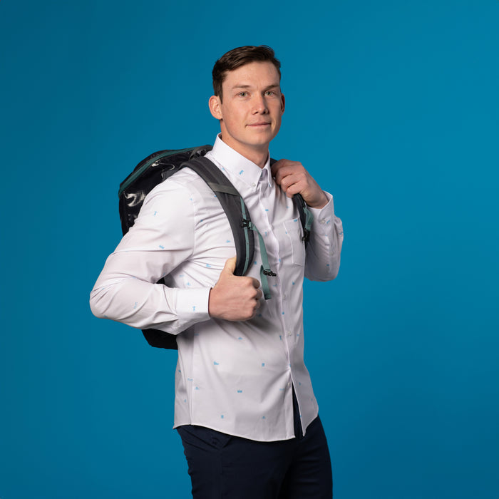 Man wearing White shirt with small blue icons of the 7 wonders