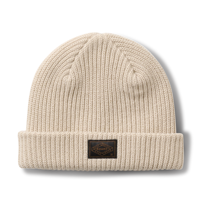 Thick woolen beanie ideal for outdoor adventure and travel by Roark, ensuring warmth and comfort in rugged environments.