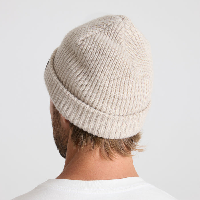 Roark woolen beanie in a cozy knit—perfect for chilly outdoor adventures and stylish travel escapades.