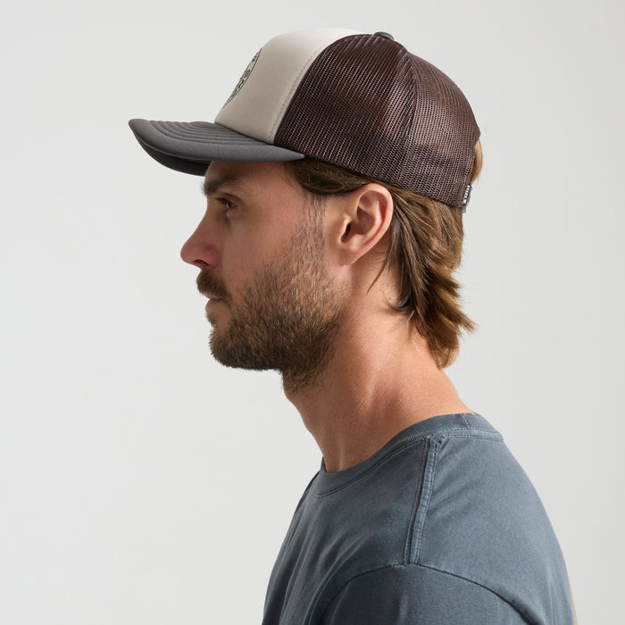 Stylish Roark trucker hat prominently displayed, perfect for adventure and outdoor enthusiasts