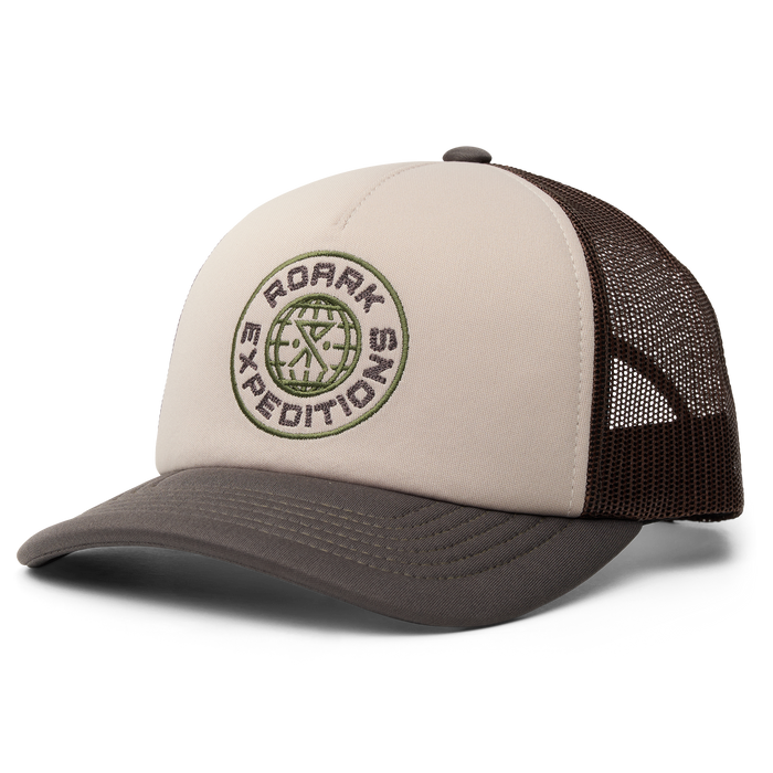 Variety of Roark trucker and cricket caps in military colors arranged stylishly.