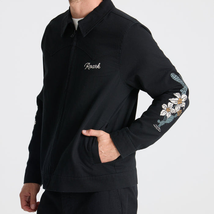 Long-sleeved black active shirt designed for adventure and outdoor activities, featuring durable fabric for travel durability by Roark.