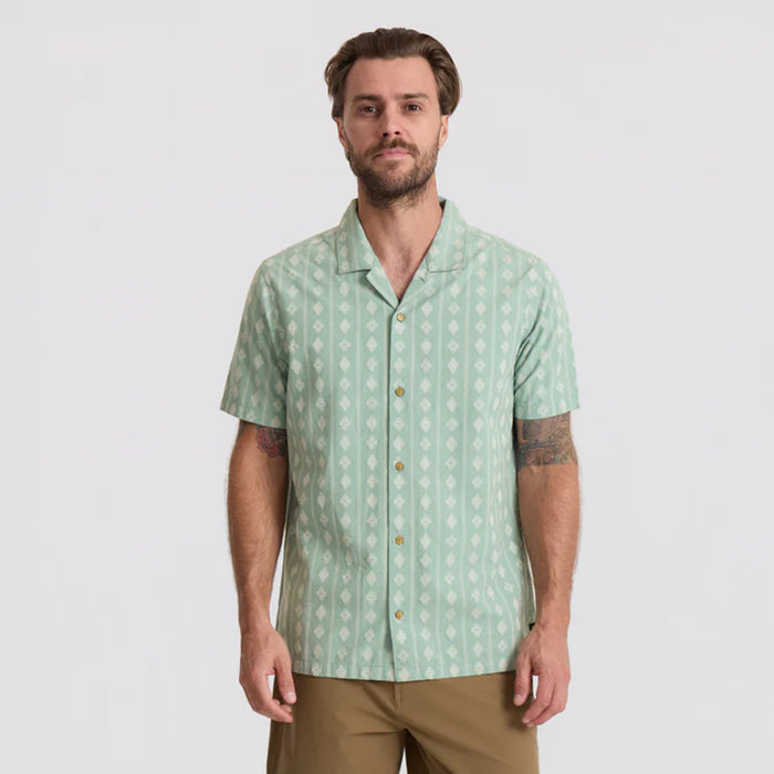 Close-up of a textured dress shirt with visible collar and buttons, designed for adventure and travel by Roark.