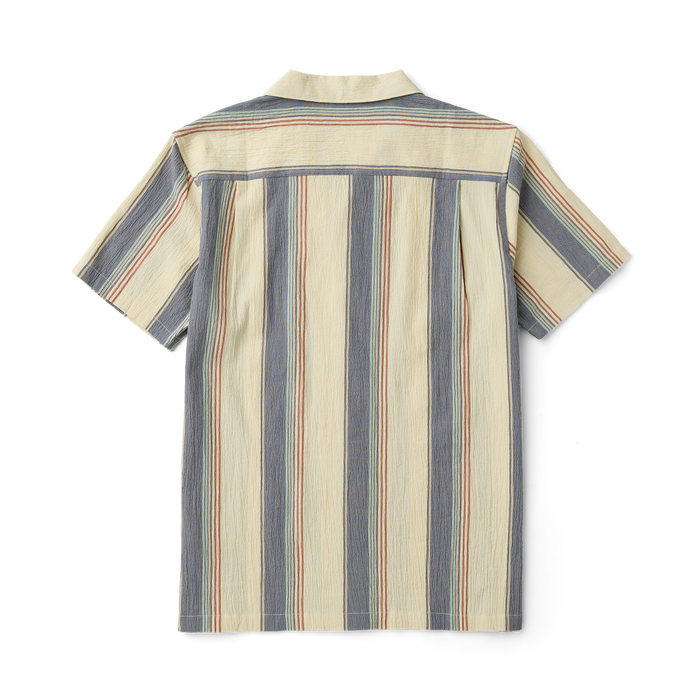 Detail view of a rugged outdoor shirt featuring durable buttons, a sturdy collar, functional pockets, and resilient sleeves designed for adventure and travel.