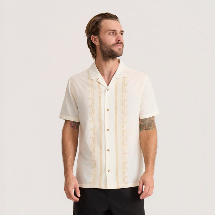Gonzo short sleeve button up shirt in unbleached cotton with cream embroidery stripes, shown on male model wearing black pants