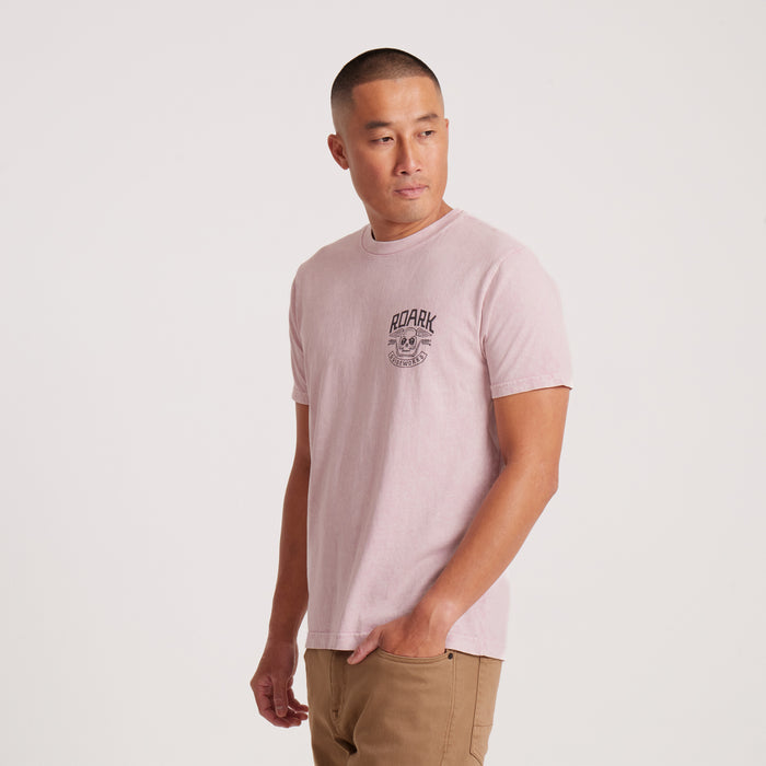 Side view of pink Roark Guideworks graphic T-shirt on model.