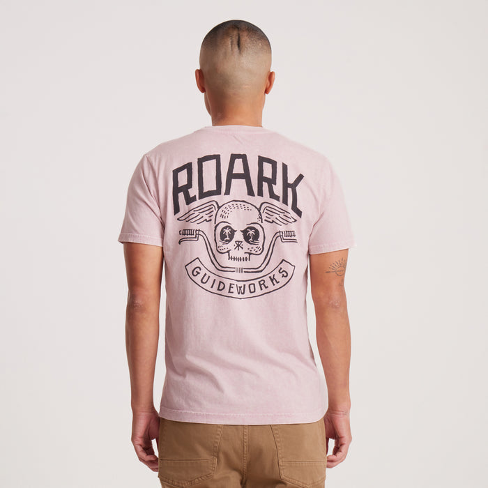 Back view of pink Roark Guideworks T-shirt with skull and handlebars graphic.