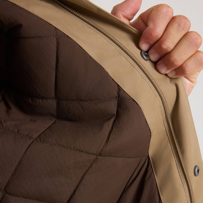Hebrides 10k Jacket in khaki with brown quilted lining, shown being held open to reveal interior detail and zipper construction