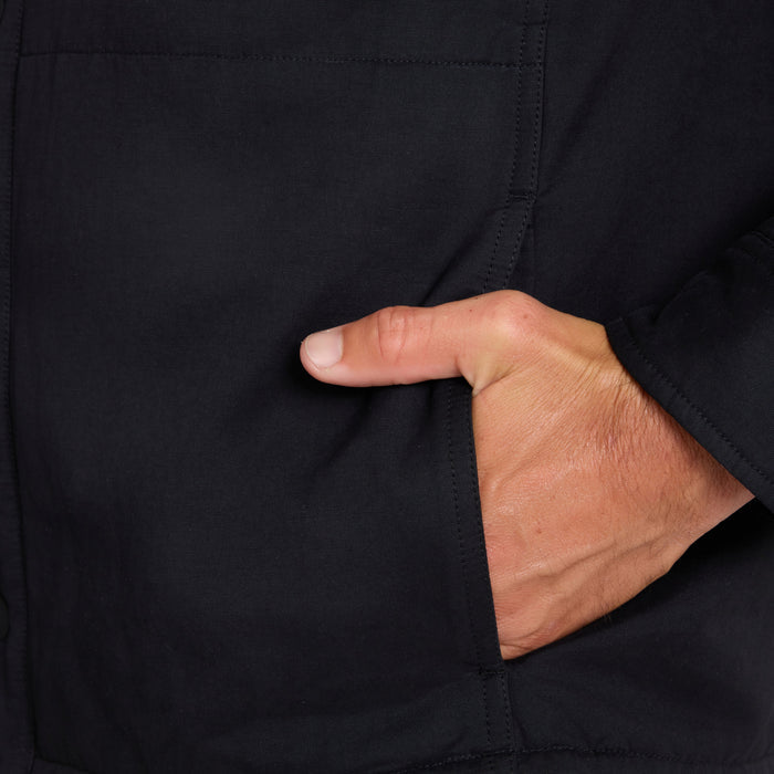 Hand in pocket of black Hebrides 2.0 Sherpa Jacket, showing functional side pocket detail and fabric texture