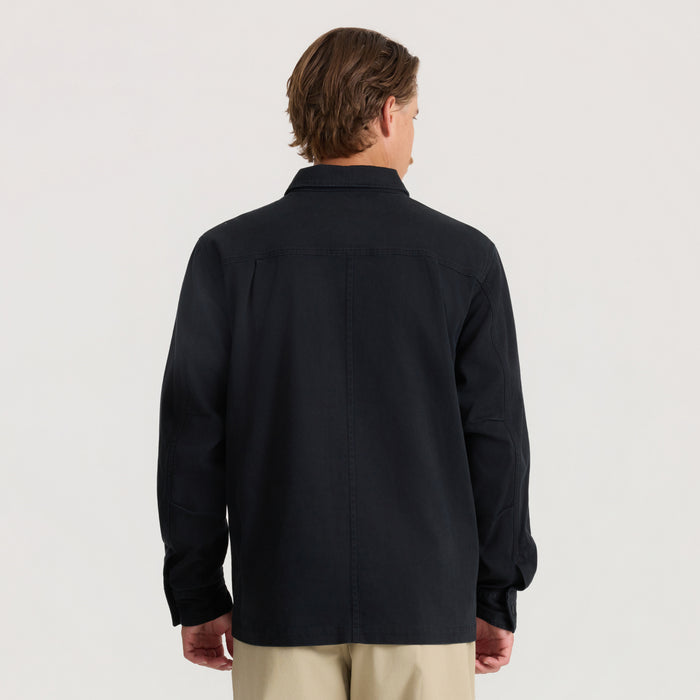 Man wearing black Hebrides 2.0 unlined jacket, shown from back view against neutral background