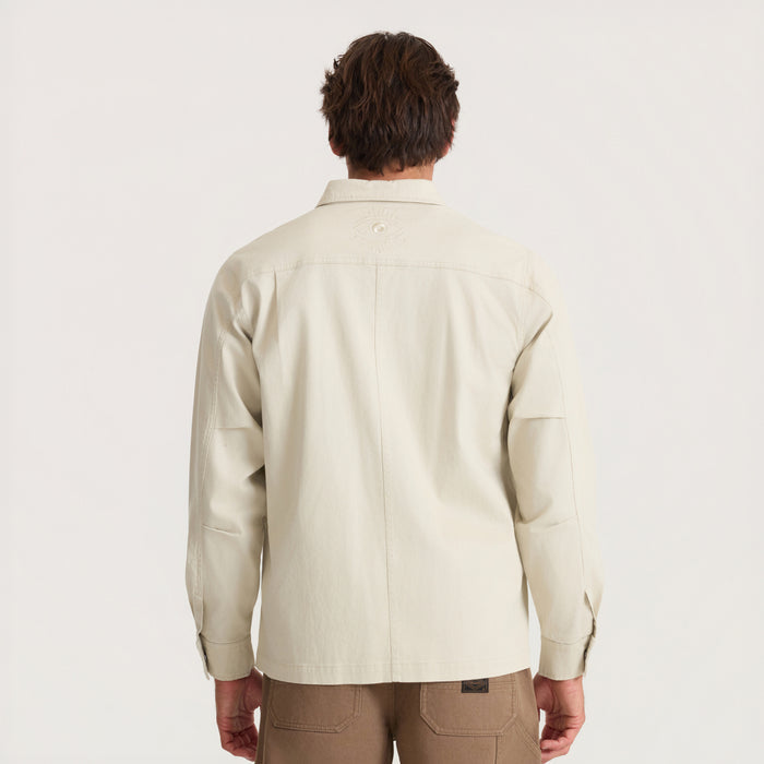 Hebrides 2.0 unlined jacket in sand worn by model shown from back view against neutral background