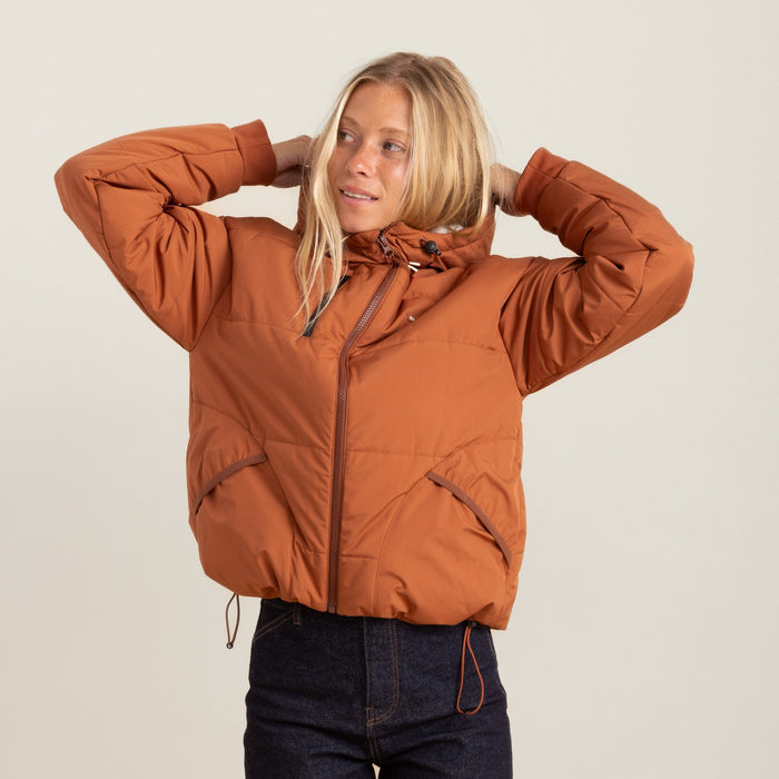 Roark Hokkaido Puffer Jacket in Coconut Shell, showcasing a front view with a model wearing it.