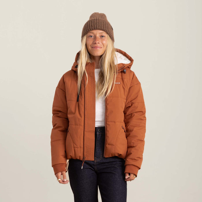 Roark Hokkaido Puffer Jacket in Coconut Shell, showcasing a front view with a model wearing it.