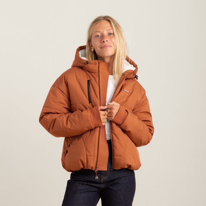 Roark Hokkaido Puffer Jacket in Coconut Shell, showcasing a back view with a model wearing it.