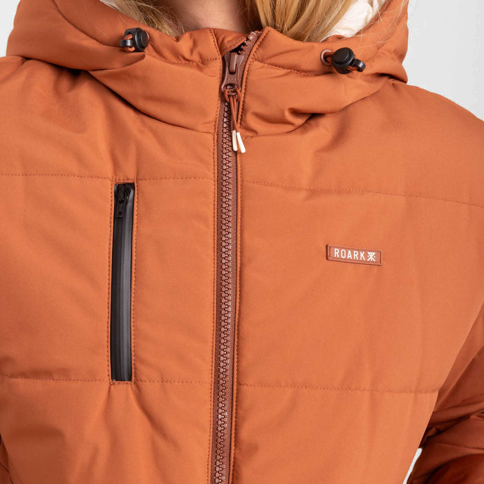 Roark Hokkaido Puffer Jacket in Coconut Shell, showcasing a front view with a model wearing it.