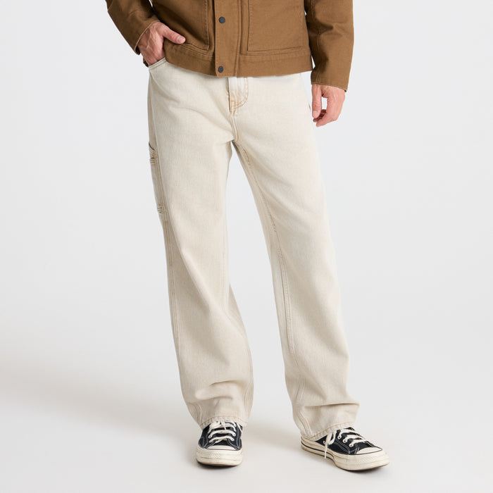 Detail of pockets and buttons on Roark adventure clothing, exemplifying durability and functionality for travel and outdoor activities.
