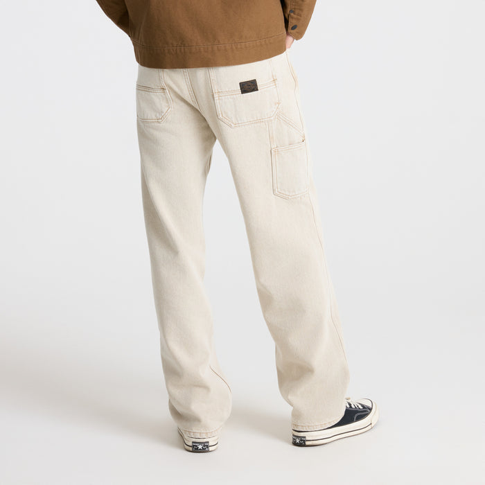 Close-up of a pocket detail on a durable fabric designed for outdoor adventures, showcasing the meticulous craftsmanship and rugged design typical of Roark travel gear.