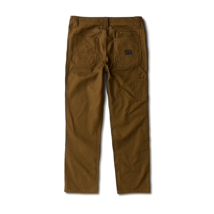 Close-up view of a pocket detail on a Roark adventure garment, emphasizing durability and functionality for travel and outdoor activities.