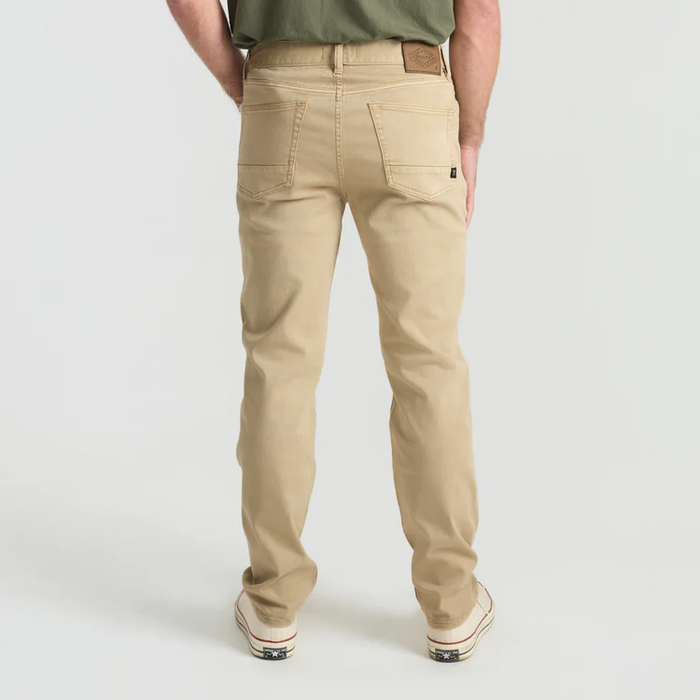 Close-up of versatile cargo khaki pants featuring pockets and buttons, ideal for outdoor adventures and travel.