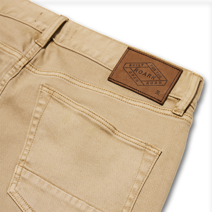 Close-up of a rugged brown disk, evoking Roark’s spirit of adventure and travel.