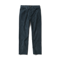 Close-up of rugged denim jeans featuring a detailed pocket, button, and label design, ideal for adventure and outdoor travel by Roark.