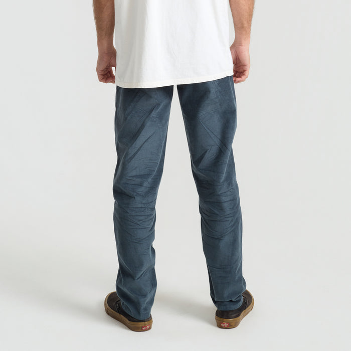 Rugged denim active pants with detailed pocket design, ideal for outdoor adventures and travel, by Roark.