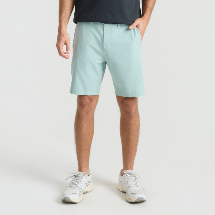 Bermuda shorts, trunks, and boardshorts designed for adventure and outdoor activities, displayed in a scenic travel setting.