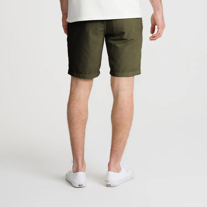 Outdoor adventurer exploring a scenic landscape, embodying the spirit of Roark's adventure and travel ethos.