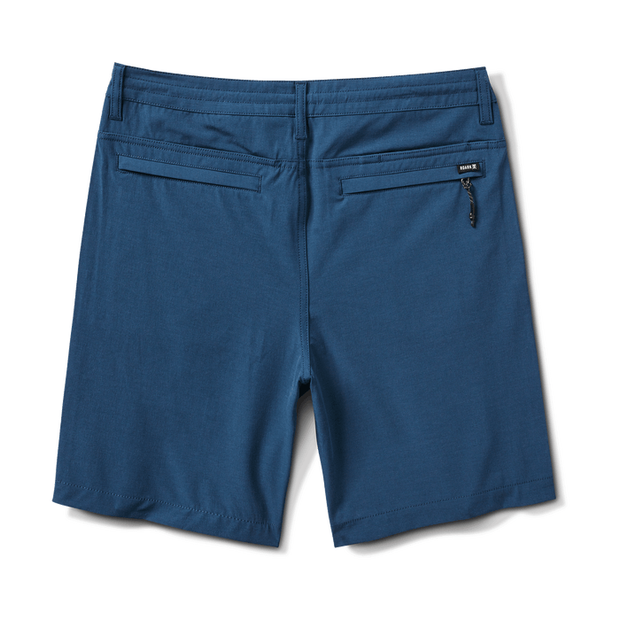 Back view of navy hybrid shorts with zippered back pockets for secure storage.