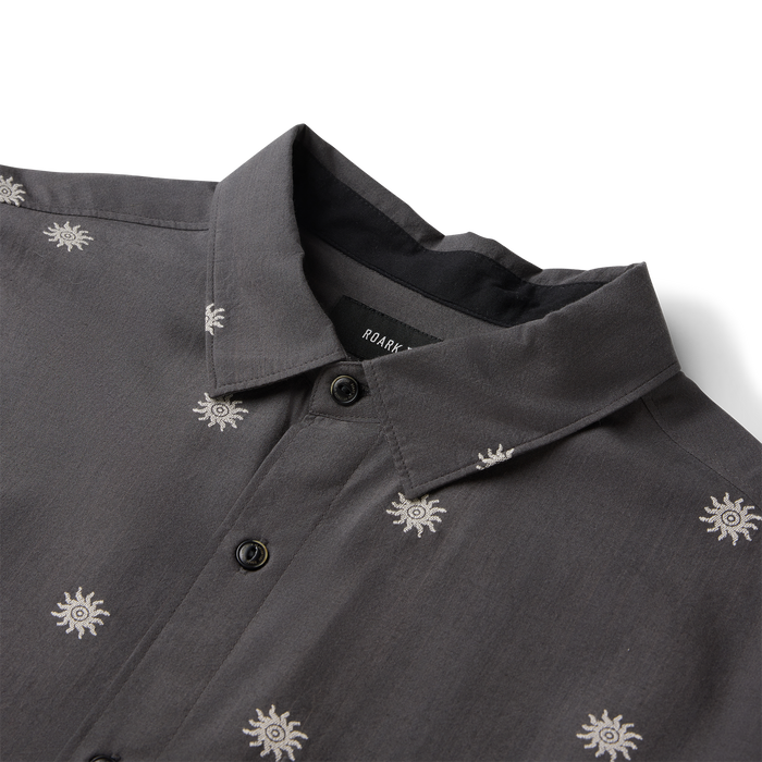 Charcoal short sleeve button up shirt with white sun embroidery, displayed flat lay showing collar and buttons detail