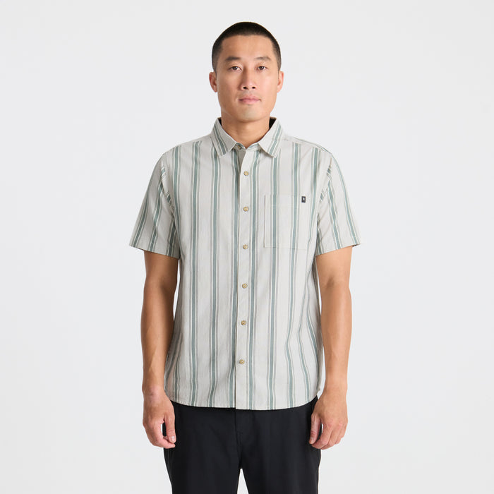 Close-up of a rugged shirt collar and button, designed for adventure and outdoor activities by Roark.