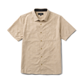 Detail of a stylish Roark dress shirt featuring a classic collar, buttons, and intricate fashion design, perfect for adventure and travel.