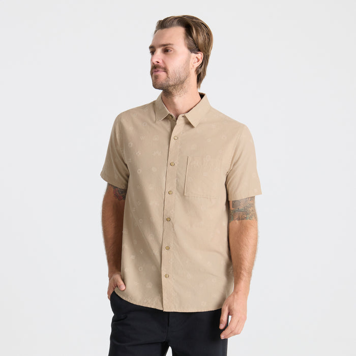 Close-up view of a high-quality Roark dress shirt featuring detailed collar and button design, perfect for adventure and travel.