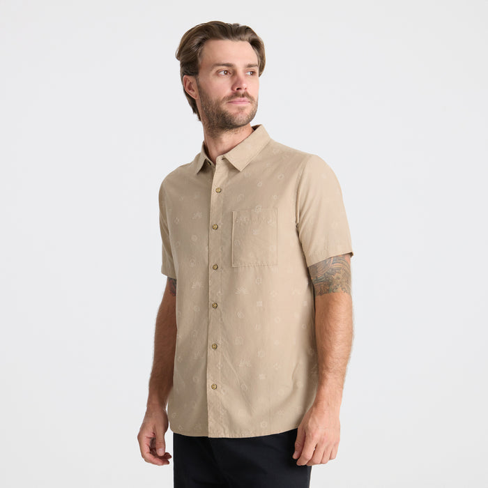 Layered adventure outfit featuring a stylish dress shirt under a rugged sweater with visible collar, button details, and pocket, perfect for outdoor exploration.