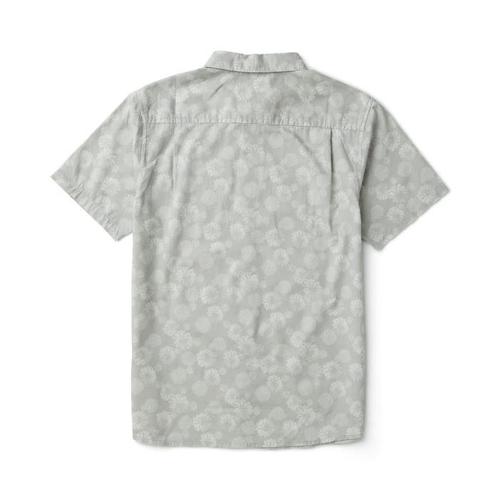 Detail view of a silver active shirt featuring a collar, sleeve, and buttons from Roark, engineered for adventure and travel.