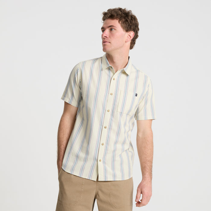 Detail of Roark's adventure-ready dress shirt featuring a crisp collar, durable buttons, and practical pocket.