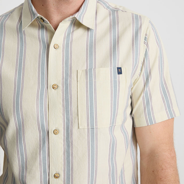 Stylish Roark button detail showcasing intricate design, perfect for adventure and travel apparel