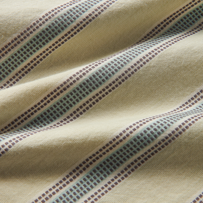 Close-up of a woven fabric in earthy brown and grey tones, embodying the rugged and adventurous spirit ideal for Roark's travel and outdoor gear.
