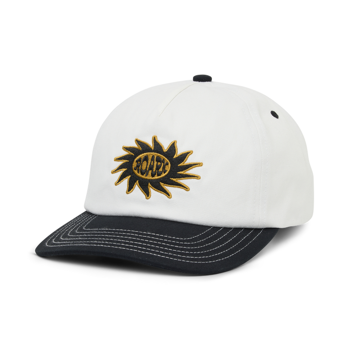 White and black Journey snapback hat with gold embroidered sun logo on front panel, displayed on white background