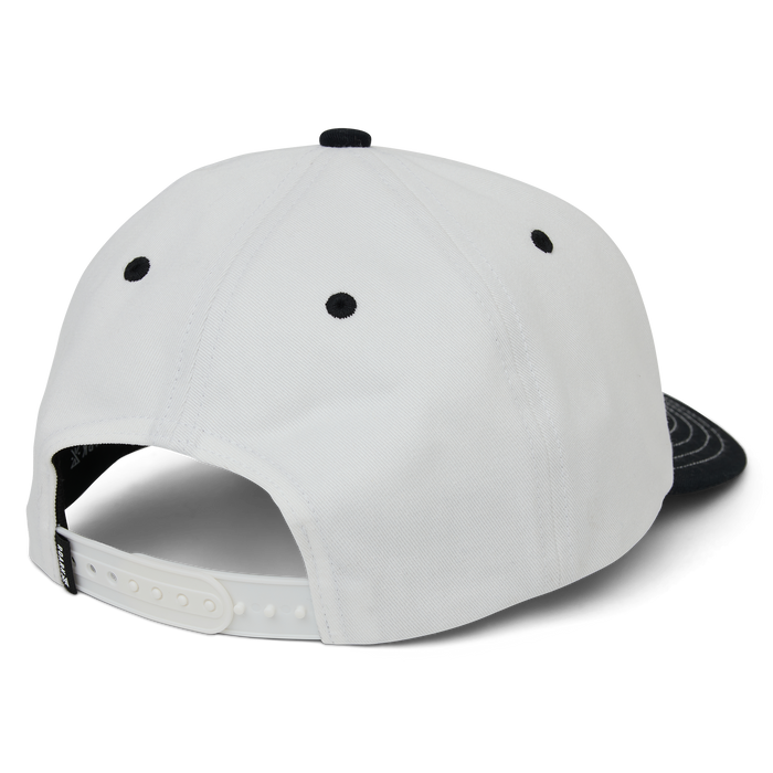 White and black colorblock snapback hat with curved visor shown from back angle, displaying snap closure and embroidered eyelets