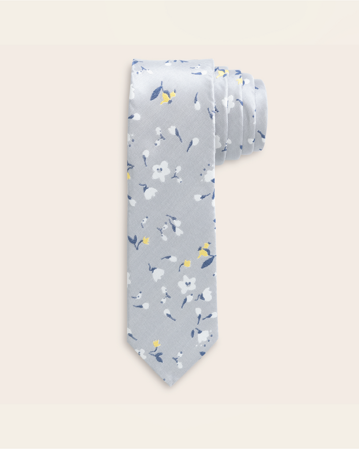 Grey tie with blue, yellow, and white floral patterned design
