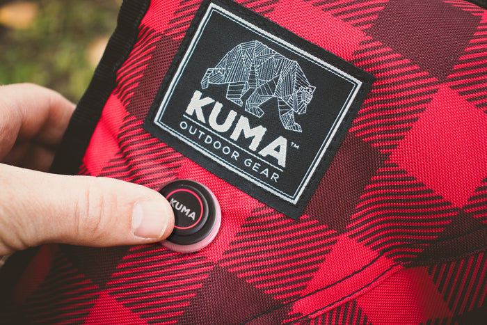 Kuma Lazy Bear Heated Chair Heat Control Button Close-Up - Red Black Plaid Fabric Detail | United RV Parts