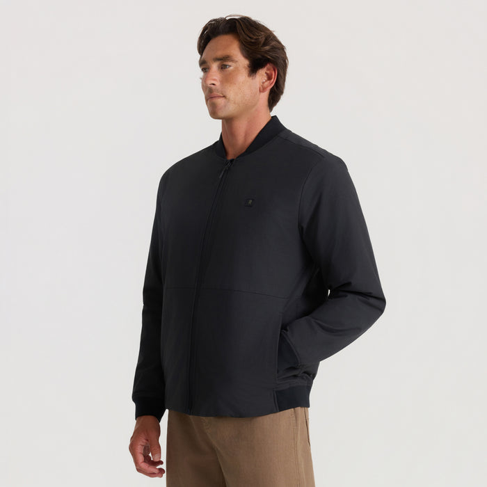 Black Layover Bomber Jacket worn by model standing against neutral background, showing zip-front closure and relaxed fit