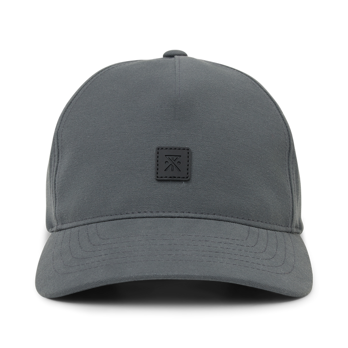 Charcoal Layover Strapback Hat with small embroidered logo patch on front, displayed against white background