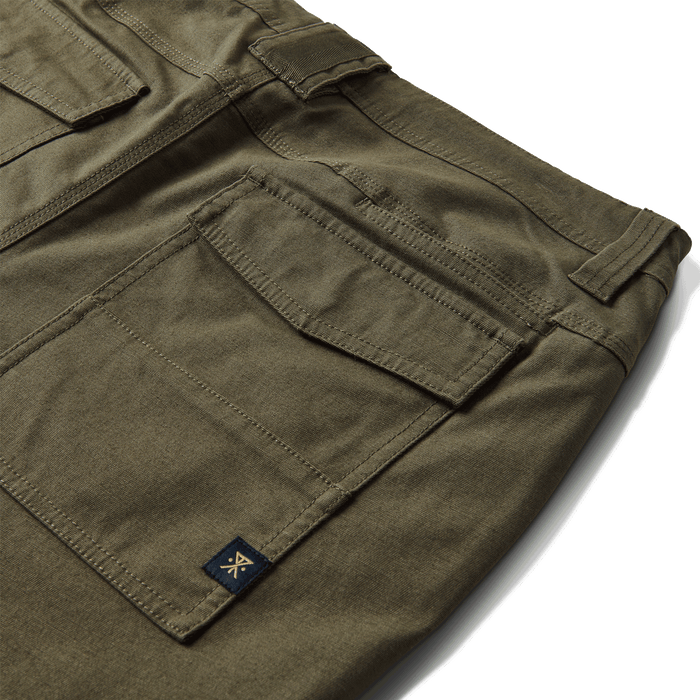 Roark Layover Utility Pants in Military, showcasing a close-up of the front of the pants.