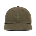 Washed military green six-panel strapback hat with embroidered circular logo on front, displayed on white background