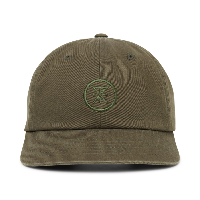 Washed military green six-panel strapback hat with embroidered circular logo on front, displayed on white background