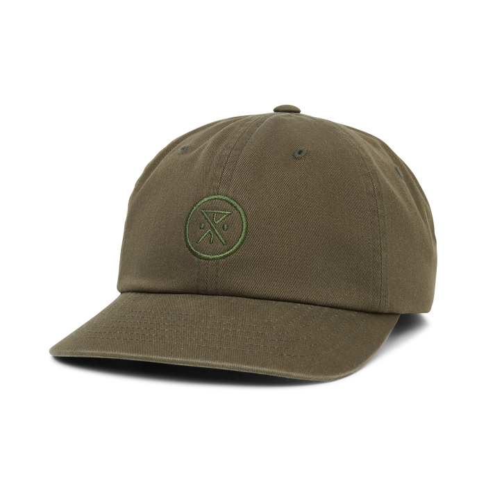 Washed military green six-panel strapback hat with small circular embroidered logo on front, displayed on white background