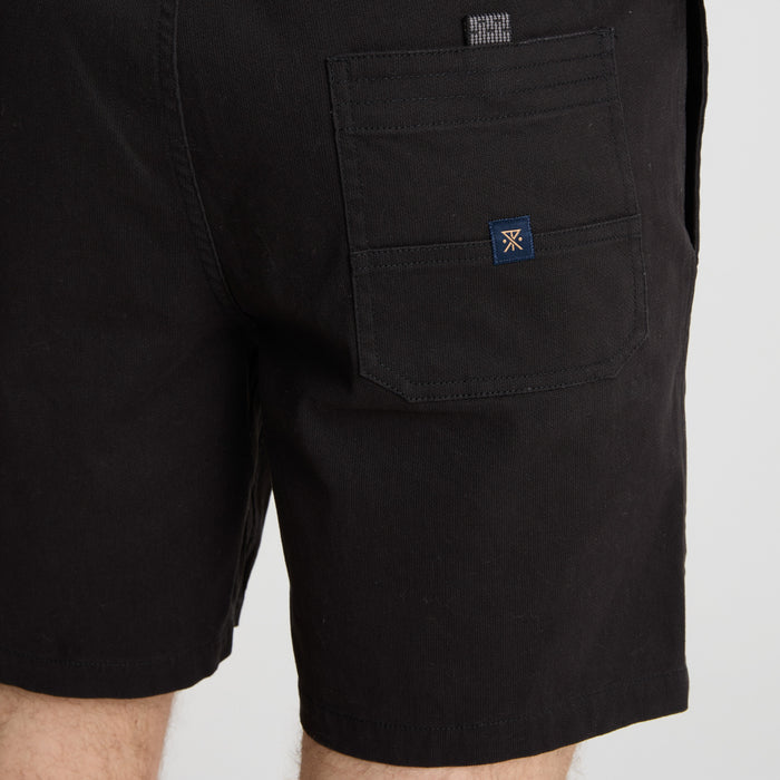 Adventure-ready Roark apparel displayed in an outdoor setting, blending with the natural scenery.