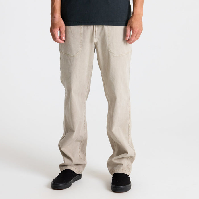 Close-up view of a staple food item peeking out from a pocket, embodying Roark's adventure travel ethos.